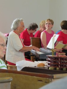 Song leader, Ann Makin, plays the keyboard while the congregation belts out in song, like the Welsh people they are.